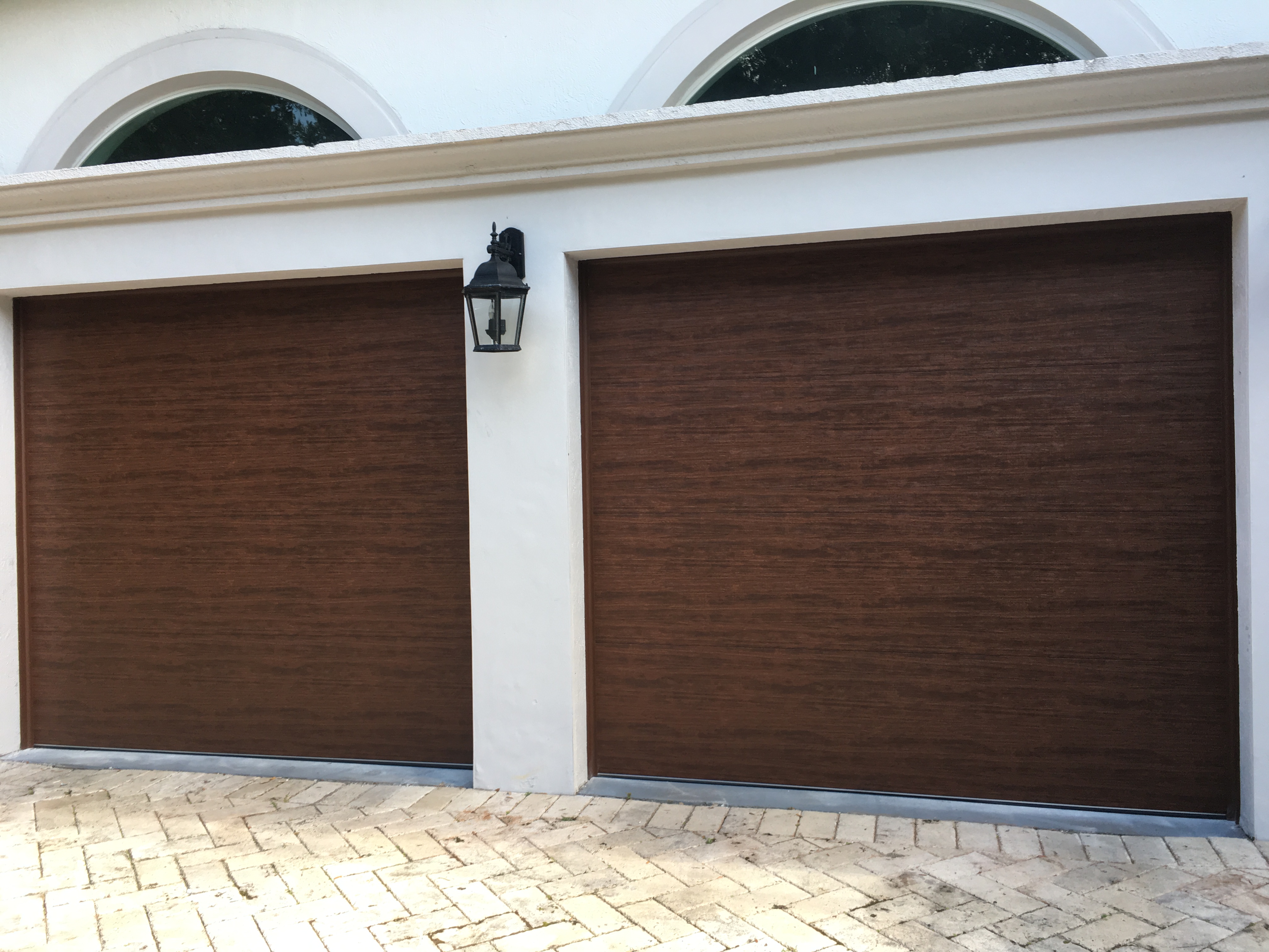Modern black flush panel garage door