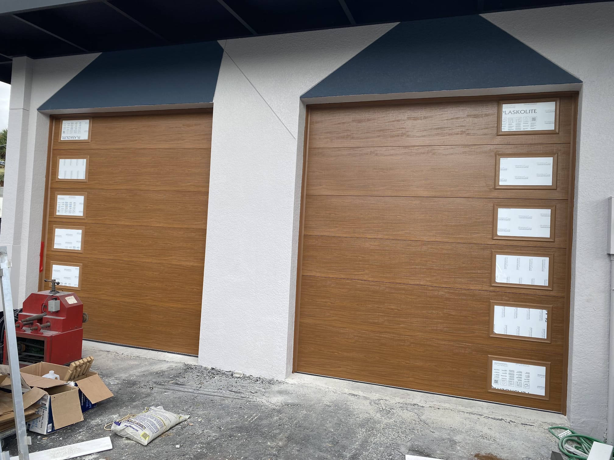 Steel garage door with wood finish
